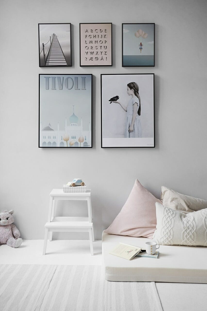 five posters mounted on wall