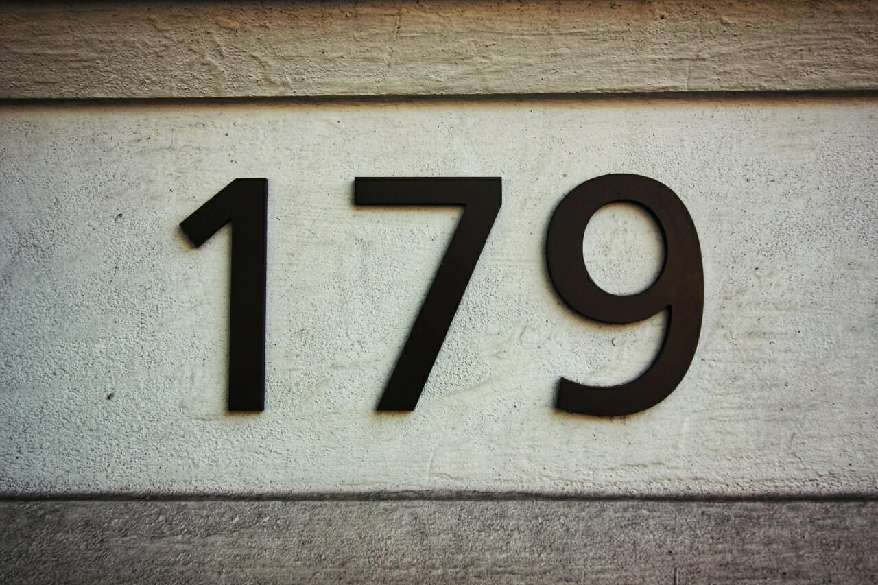 street numbers embossed on stone