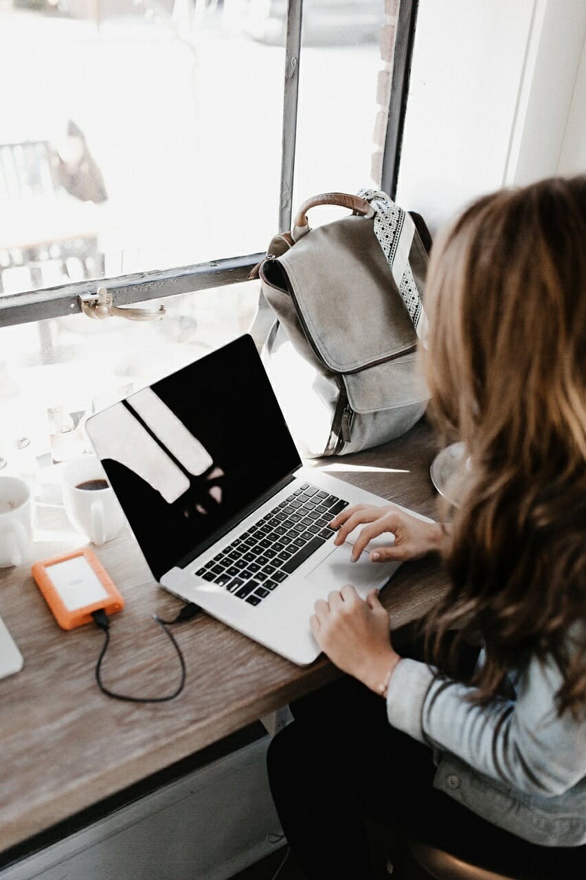close up of women using laptop