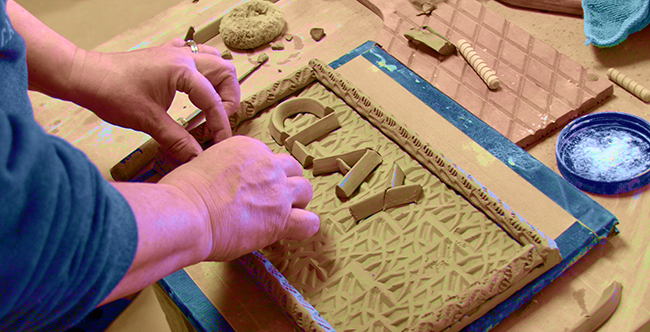 woman using polymer clay