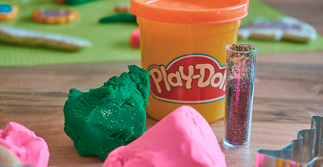 play-doh, green and pink and some glitter