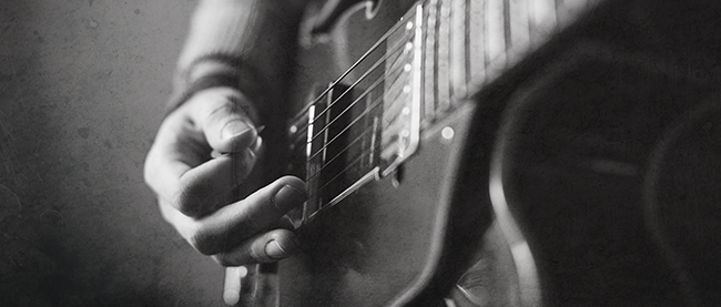 playing the guitar with the pick